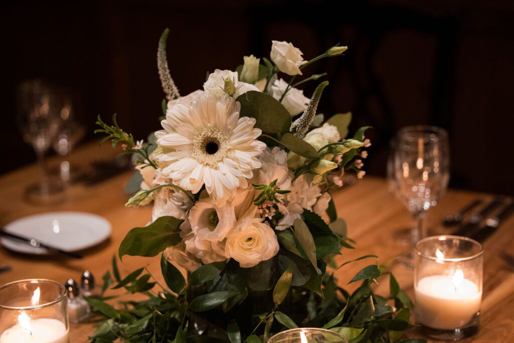 white and green floral display on a table in the Palmer Room at the O.Henry Hotel for an elopement