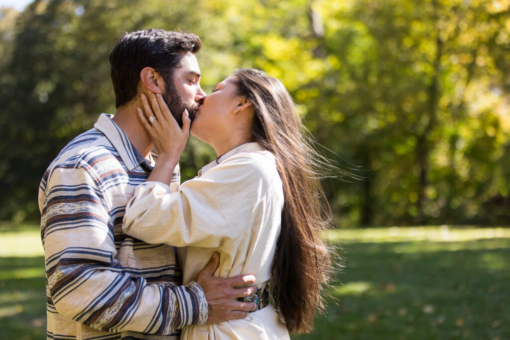 couple kisses after their surprise proposal at the biltmore estate