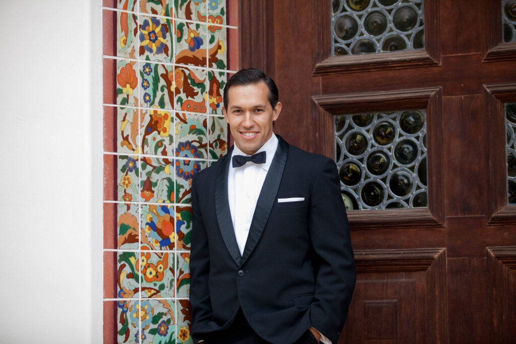 handsome groom at the front door of the adamson house in malibu