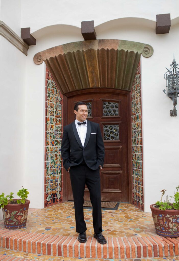groom in a black tie at the adamson house in malibu