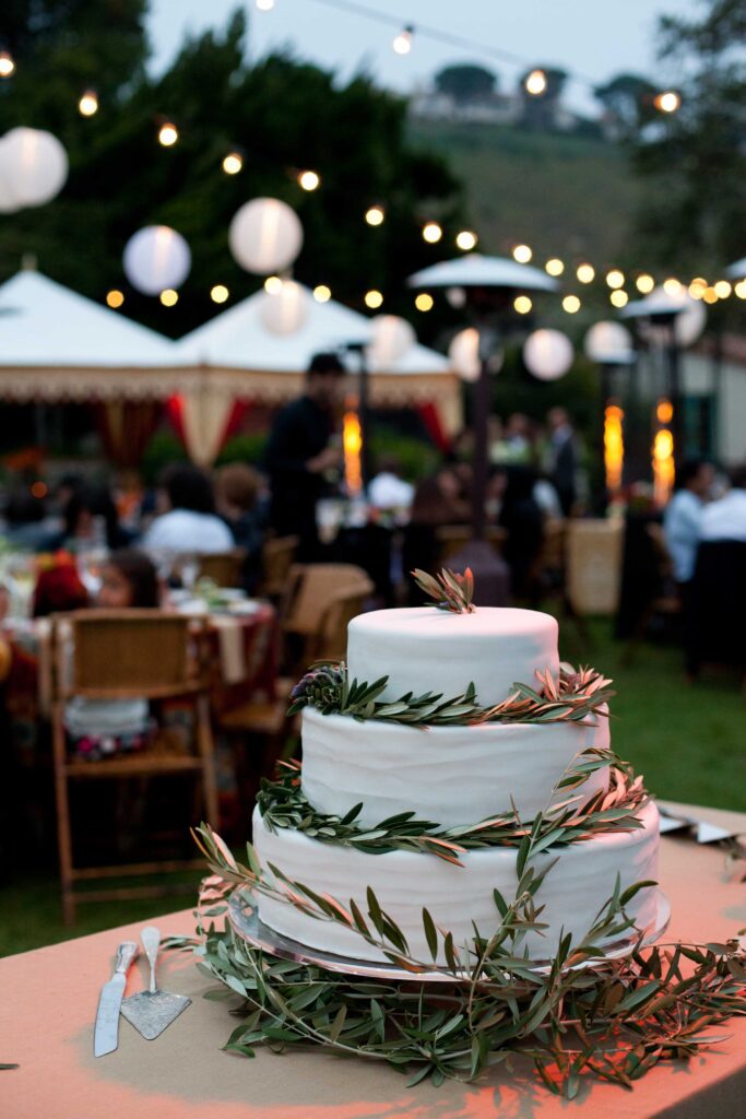 wedding cake on the lawn facing the ocean at malibu's adamson house
