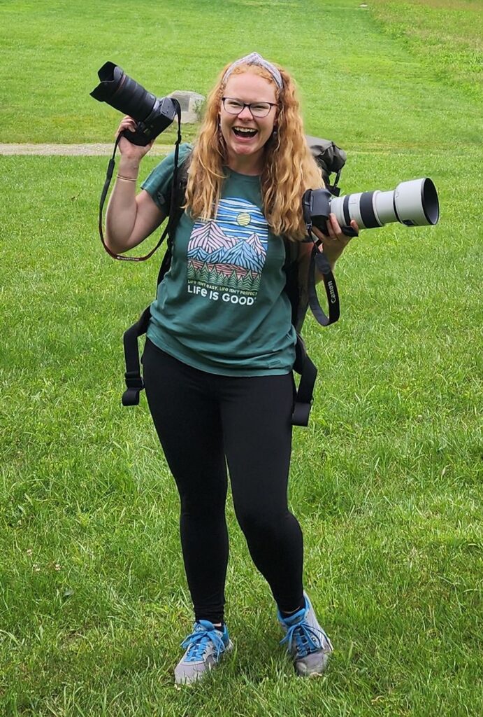 Jenny Friedrichs of Golden Hour Elopements, with two cameras and backpack on for an adventure elopement