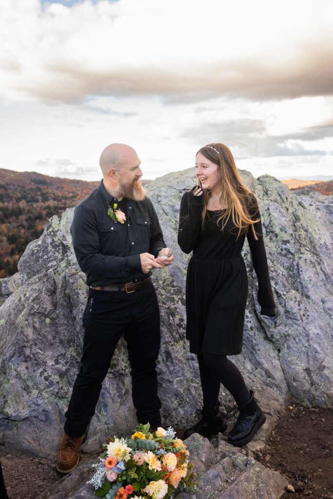 Stepdad reading special vows and giving a gift to his new stepdaughter during a family elopement ceremony at Grayson Highlands State Park.