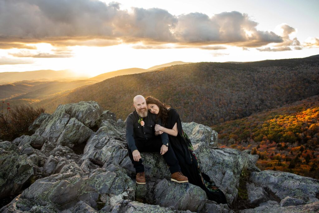 elopement portraits on a rocky mountaintop in va with an epic golden sunset