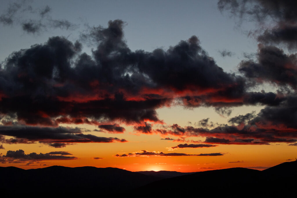 orange pink and purple sunset at Little Pinnacle at Grayson Highlands State Park in Virginia