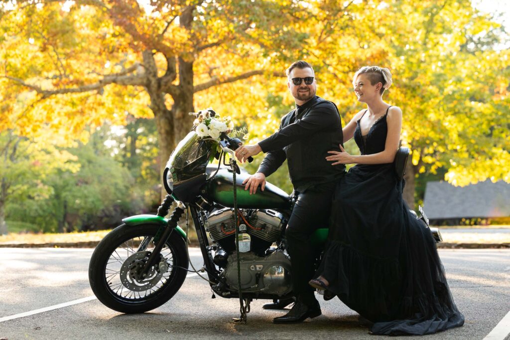 couple on a motorcycle during their fall elopement at hanging rock state park in nc