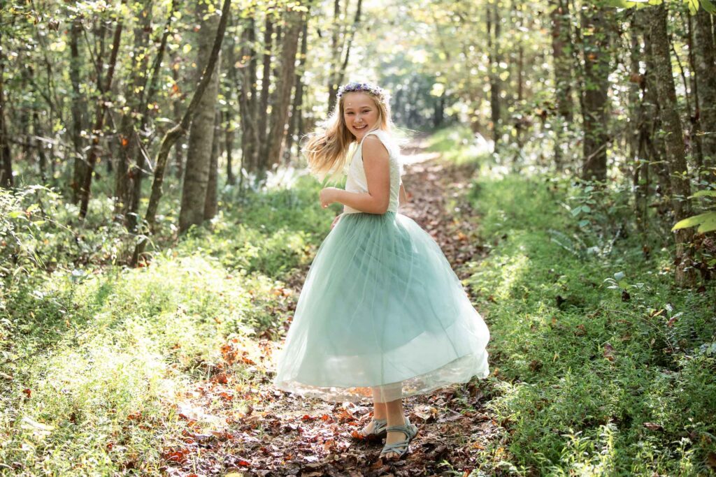 Family elopement at Pilot Mountain State Park with couple and child by the Yadkin River