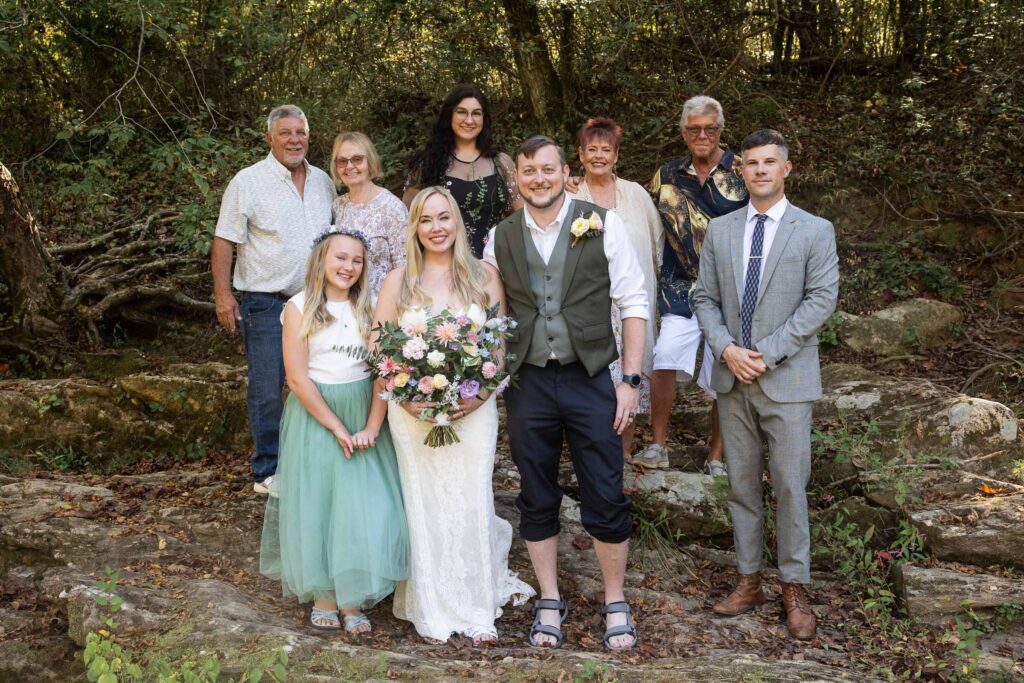 Family elopement at Pilot Mountain State Park with couple and child by the Yadkin River