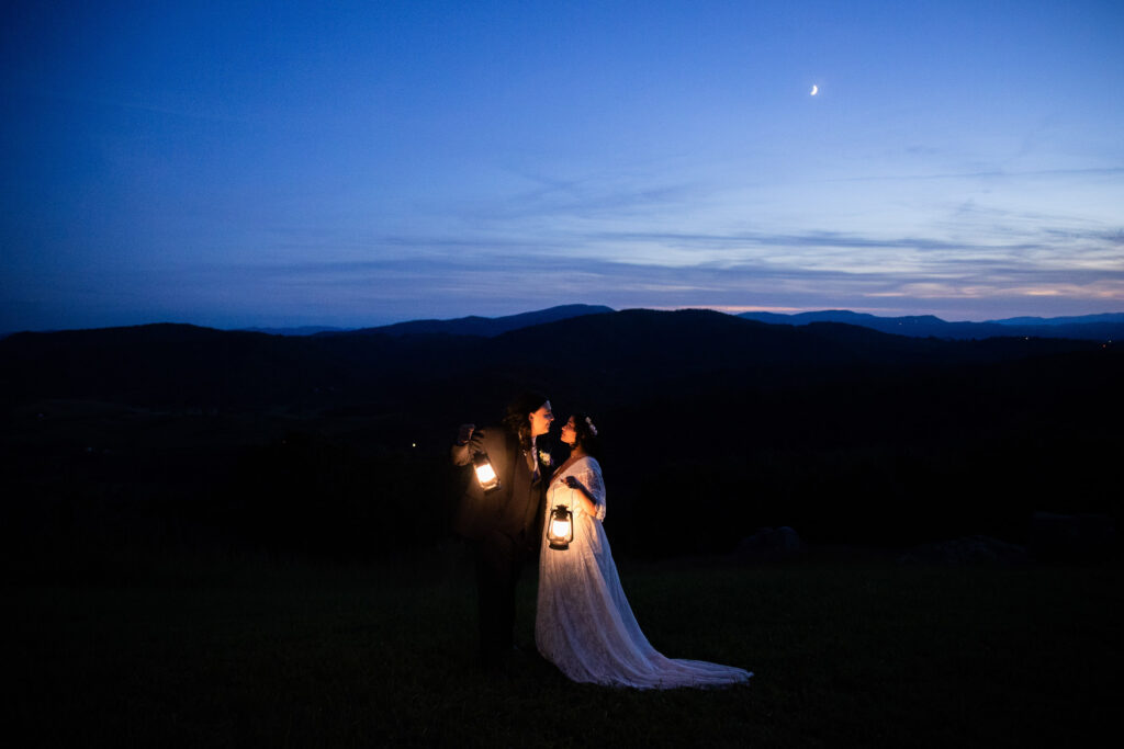 couple eloping on a mountain in va with lanterns