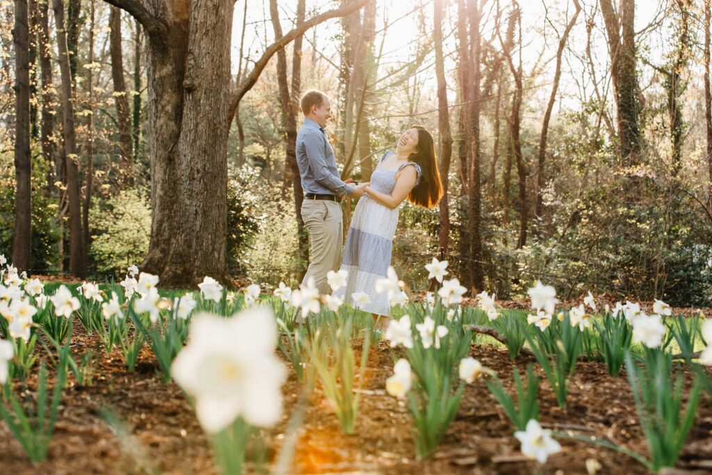 engaged couple laughs during their engagement session at the graylyn estate