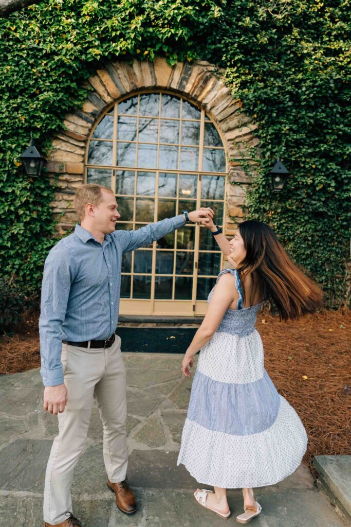 newly engaged couple dances at the graylyn estate after their proposal