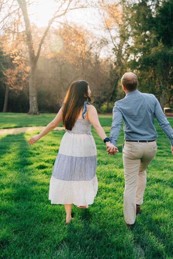 couple celebrates after their proposal at the graylyn estate