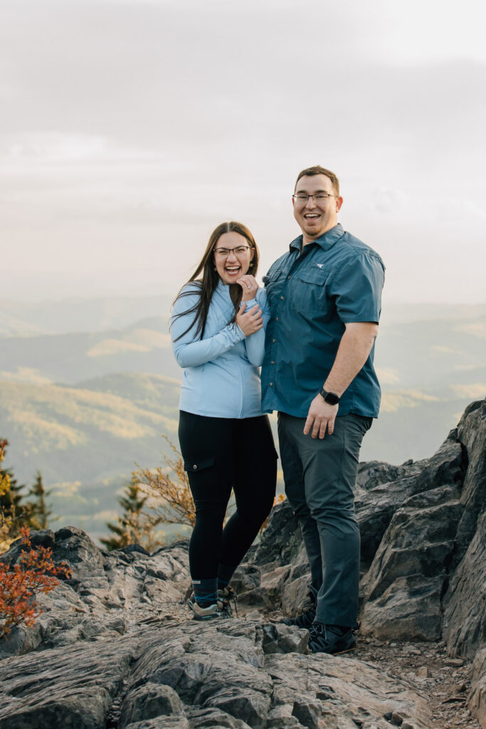 couple celebrates after their proposal at grayson highlands state park in virginia