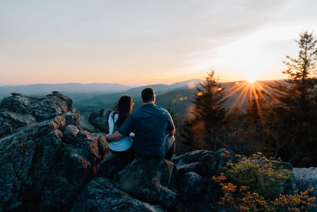 couple enjoys the sunset after their surprise proposal at grayson highlands