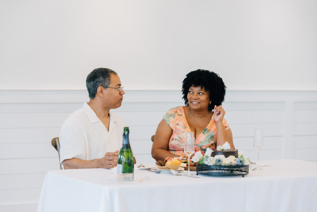couple enjoys cake and charcuterie during vow renewal at the barn at reynolda in winston-salem, nc