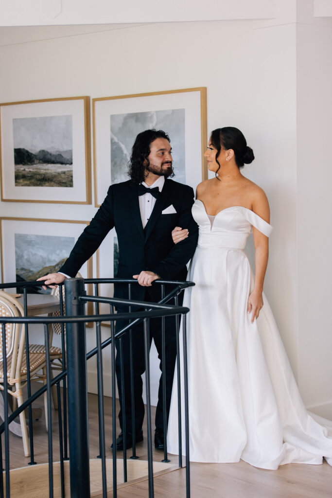 a couple gets ready and has a first look before their nc elopement at their airbnb