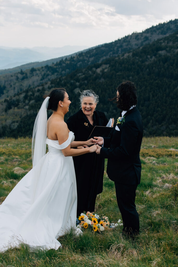 officiant smiles during elopement ceremony at roan mountain
