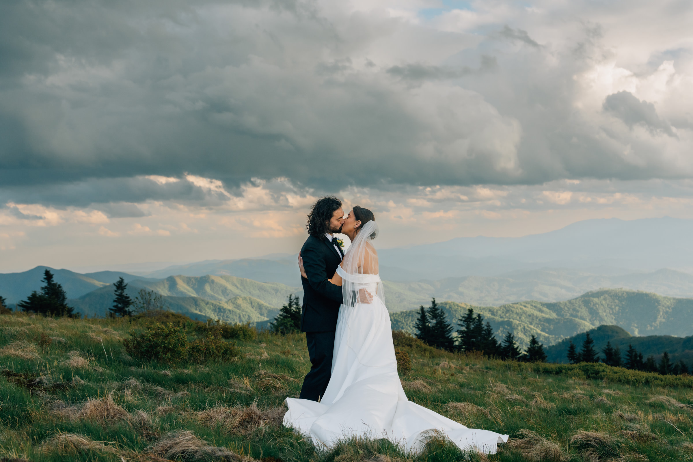 couple kisses during their carver's gap elopement in the spring