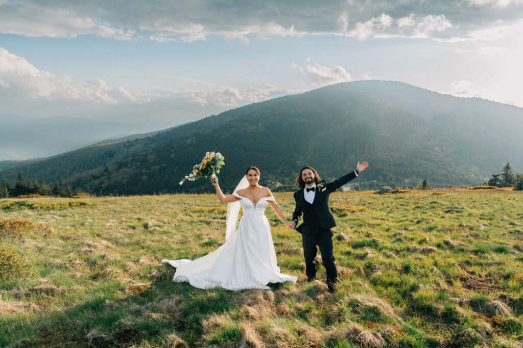 couple cheers after their mountain elopement ceremony in nc
