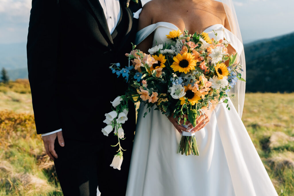beautiful bridal bouquet with sunflowers for a mountain sunset elopement at carver's gap