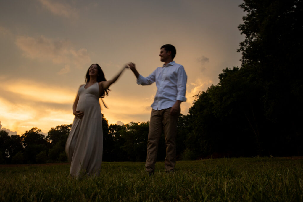 fleurish greenhouse sunset during a maternity photo shoot in taylorsville, nc