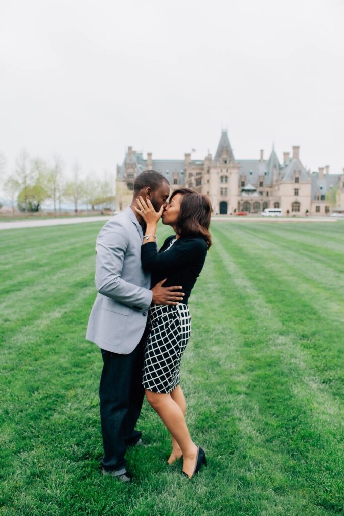 couple kisses after their biltmore proposal