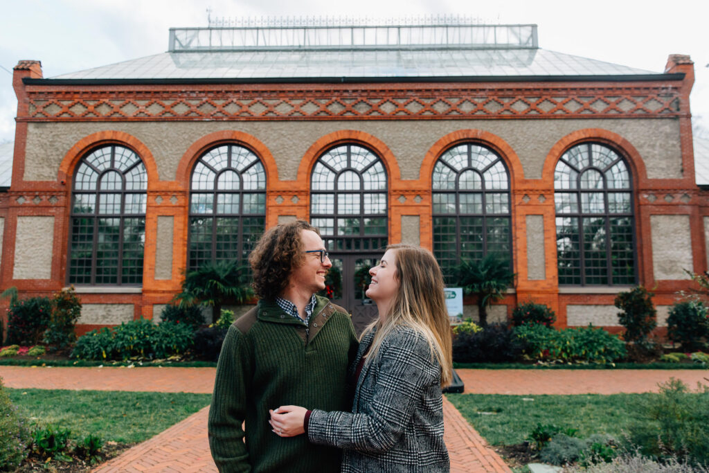 engaged couple in front of the biltmore estate conservatory